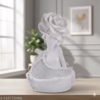 Elegant white resin figurine of a child holding a basket with a large rose on the head – Decorative home showpiece for shelves, tables, and living spaces