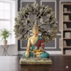 Decorative Buddha statue in colorful robes seated under a stylized Bodhi tree with detailed leaves.