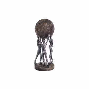 Decorative sculpture of three human figures lifting a textured globe, placed on a wooden table in a modern living room setting, symbolizing teamwork and unity.